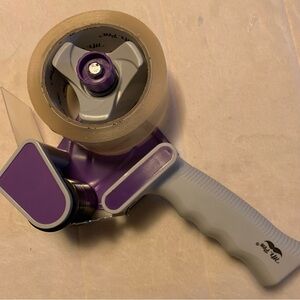 Tape dispenser gun with packing tape